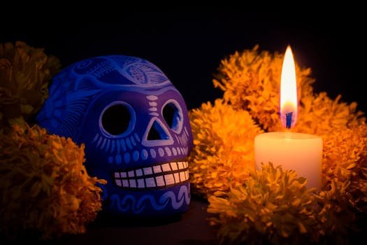 pexels-photo-19074237-19074237 Colorful Catrina and marigolds glowing in candlelight for Día de Muertos celebration.