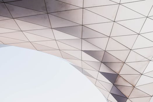 pexels-photo-3137058-3137058 Abstract architectural detail showcasing a geometric pattern with triangles under natural light.